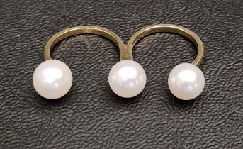 UNUSUAL PEARL SET EIGHTEEN CARAT GOLD TWO FINGER RING the three pearl finials set at the edges and