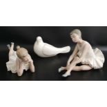 THREE NAO FIGURINES comprising a seated ballerina adjusting her shoe, 14cm high, a ballerina lying