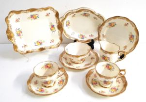 ROYAL ALBERT TEA SERVICE the cream ground and flowers with gilt highlights, comprising ten cups,