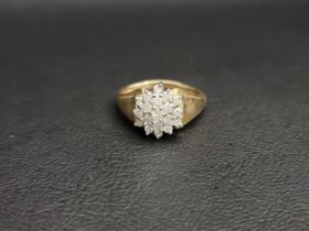 DIAMOND CLUSTER RING in nine carat gold, the diamonds totalling approximately 0.5cts in stepped