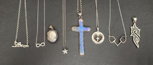 EIGHT SILVER AND SILVER MOUNTED PENDANTS/NECKLACES including a large iridescent cross pendant, an