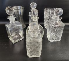 SELECTION OF CUT GLASS DECANTERS AND STOPPERS and two vases