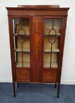 EDWARDIAN MAHOGANY AND INLAID DISPLAY CABINET with a central panel inlaid with a bow, flowers and