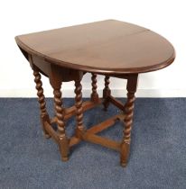 OAK GATELEG TABLE with shaped drop flaps, standing on barley twist supports, 71.5cm wide
