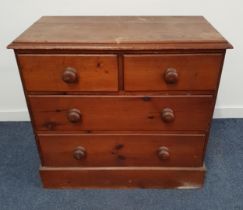 VICTORIAN PINE CHEST OD DRAWERS with a moulded top above two short and two long drawers, standing on
