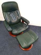 EKORNES STRESSLESS ARMCHAIR in green leather with a reclining back and rotating base, together