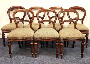 SEVEN ASSOCIATED VICTORIAN MAHOGANY BALLOON BACK DINING CHAIRS with shaped stuffover seats