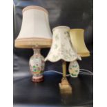 JAPANESE STYLE TABLE LAMP decorated with classical figures, with a shaped cream shade, 75cm high