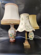 JAPANESE STYLE TABLE LAMP decorated with classical figures, with a shaped cream shade, 75cm high