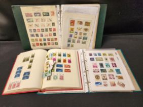 SELECTION OF FIVE STAMP ALBUMS featuring stamps from around the world, including many Penny Reds