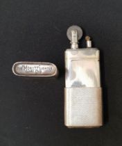 GEORGE VI SILVER CIGARETTE LIGHTER marked The Howitt Lighter, with engine turned decoration,