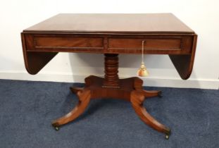 REGENCY ROSEWOOD AND CROSSBANDED SOFA TABLE with shaped drop flaps above two opposing and dummy
