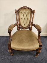 VICTORIAN WALNUT OPEN ARMCHAIR with a shaped button back and outswept arms above a shaped