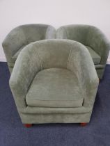 THREE HORSE SHOE BACK ARMCHAIRS with padded backs and seats and a shaped loose seat cushion, covered