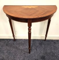 MAHOGANY AND INLAID DEMI LUNE SIDE TABLE standing on turned and tapering supports, 75cm high