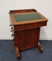 VICTORIAN WALNUT DAVENPORT with a three quarter galleried top with two glass ink bottles and a pen