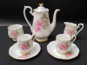 BONE CHINA COFFEE SET decorated with a white ground and roses with gilt highlights, signed to the