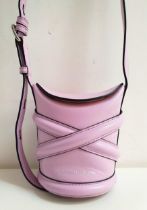 ALEXANDER MCQUEEN CURVE MINI BUCKET BAG in lilac leather, the flap with magnetic closure,