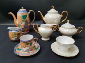 JAPANESE EXPORT WARE COFFEE SET decorated with cranes on an orange and indigo ground, comprising six