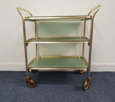 CAREFREE GILT METAL TROLLEY with three tiers, the top tier being a removeable tray, standing on
