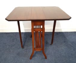 MAHOGANY AND CROSSBANDED SUTHERLAND TABLE with canted corner drop flaps, on tapering supports with