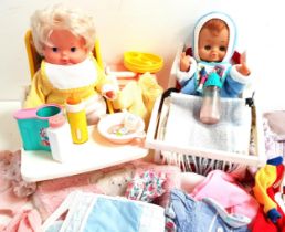 TWO BOXES OF DOLLS and dolls clothes, including a Fisher Price high chair with folding tray, a