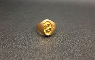 FRENCH EIGHTEEN CARAT GOLD SIGNET RING the oval cartouche with stylised letters 'FR', ring size L-