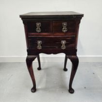 TEAK SIDE TABLE with two short frieze drawers above a long drawer, standing on cabriole supports,