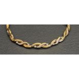 CZ SET NINE CARAT GOLD BRACELET 18.8cm long and approximately 7.8 grams