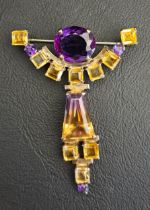 UNUSUAL GEM SET BROOCH the central ametrine with citrines and amethysts above and below in shaped