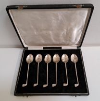 SET OF SIX NOVELTY SILVER TEA SPOONS the stems modelled as golf clubs, marked sterling silver, in