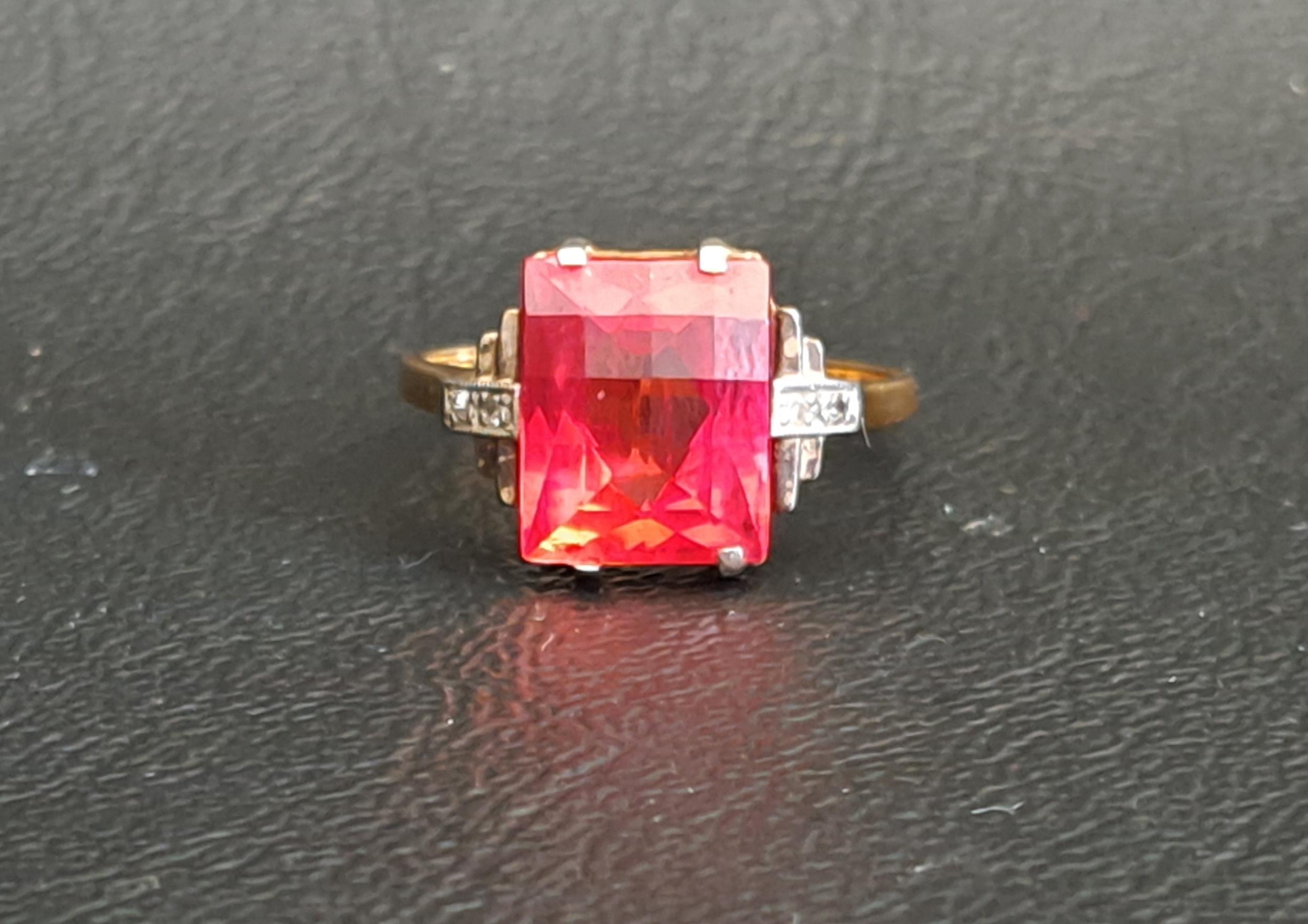 RED GEM AND DIAMOND SET RING the central checkerboard cut gemstone possibly ruby and measuring - Image 3 of 3