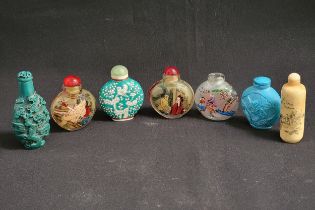 SEVEN CHINESE SNUFF BOTTLES comprising a green ground example decorated with birds in a tree, with a