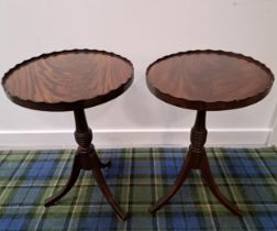 PAIR OF OVAL MAHOGANY WINE TABLES with scalloped edges, on a turned column and tripod base, 56cm