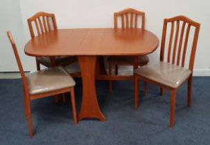 TEAK DROP FLAP TABLE AND FOUR CHAIRS the table with shaped flaps and gate leg action, 73.5cm high,