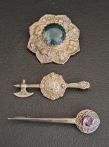 TWO CELTIC SILVER BROOCHES one with central agate in relief thistle decorated surround, another in