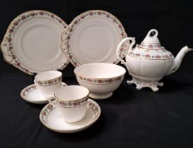 PORCELAIN TEA SET decorated with a floral border with gilt highlights on a white ground,