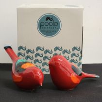 PAIR OF POOLE POTTERY VOLCANO BIRDS with vibrant red bodies with orange hues, boxed and 15cm long (