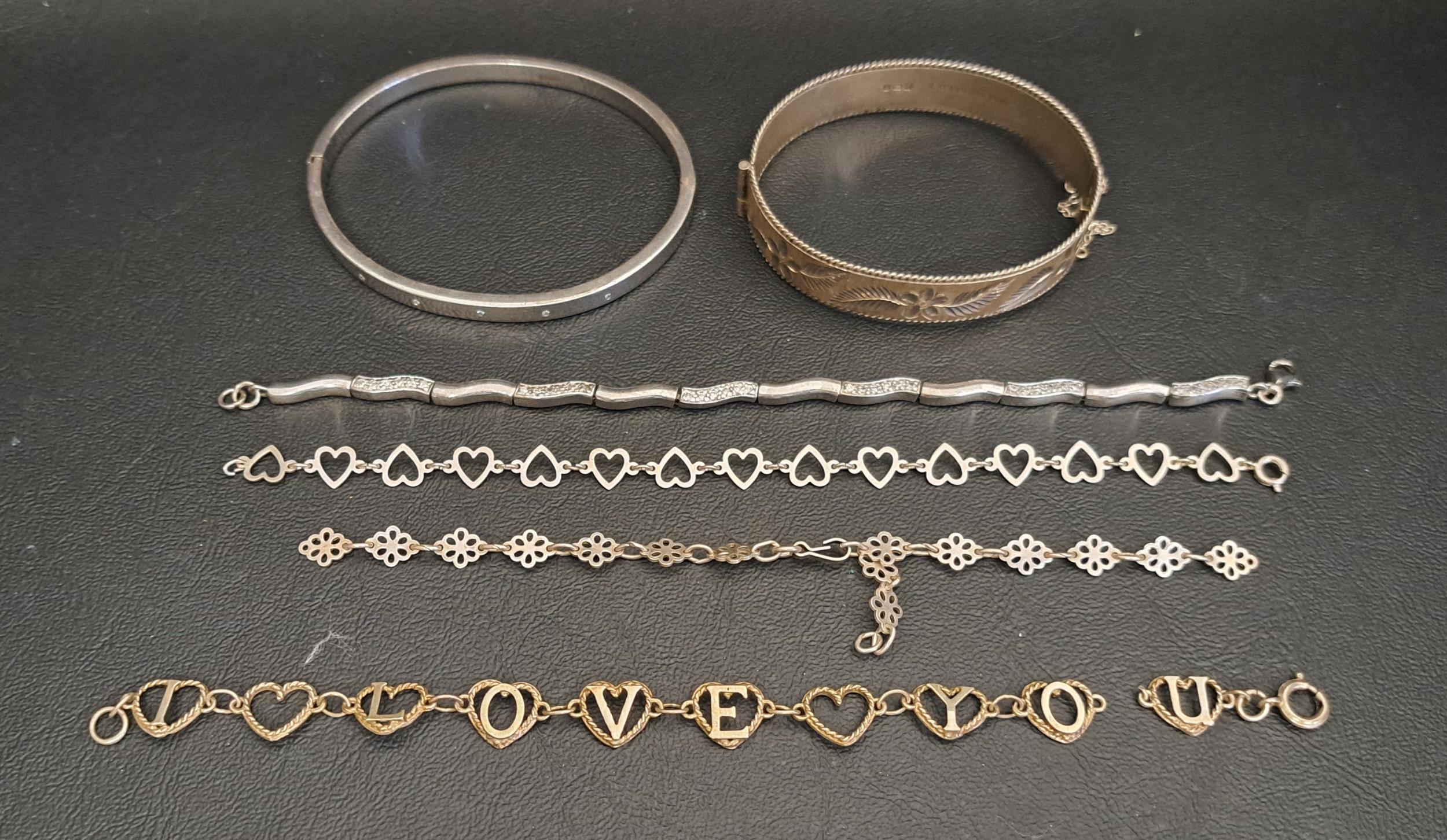 TWO SILVER BANGLES AND FOUR SILVER BRACELETS one bangle with engraved foliate decoration and the