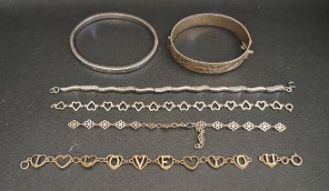 TWO SILVER BANGLES AND FOUR SILVER BRACELETS one bangle with engraved foliate decoration and the