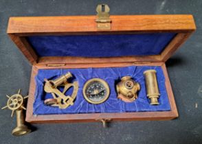 CASED SET OF MINIATURE BRASS NAUTICAL INSTUMENTS/ITEMS comprising a sextant, a three draw telescope,