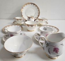 ROYAL TROON TEA SERVICE comprising six cups and saucers, six cake plates, serving plate, milk jug