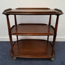 ERCOL STAINED ELM TROLLEY with three galleried tiers, on casters, 74cm x 72cm x 46cm