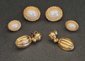 THREE PAIRS OF NINE CARAT GOLD EARRINGS comprising one pair with ribbed oval drops, approximately