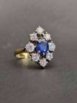 IMPRESSIVE SAPPHIRE AND DIAMOND CLUSTER DRESS RING the central oval cut sapphire approximately