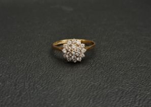 DIAMOND CLUSTER RING the diamonds in stepped setting totalling approximately 0.6cts, ring size L and