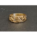 NINE CARAT GOLD RING with pierced floral and scroll decoration, ring size L and approximately 1.9