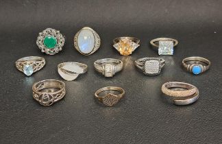 SELECTION OF TWELVE SILVER RINGS including a blue topaz single stone ring, turquoise, marcasite