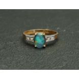 OPAL TRIPLET AND DIAMOND DRESS RING the central oval cabochon opal triplet measuring approximately