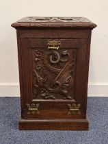 EDWARDIAN CARVED OAK COAL PURDONIUM the lid carved with a 'WB' above a fall door decorated with a